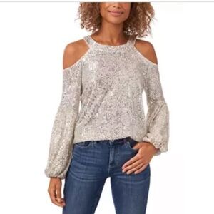 NWT CeCe Women’s long sleeve, cold shoulder, sequined blouse in Champagne. Med.